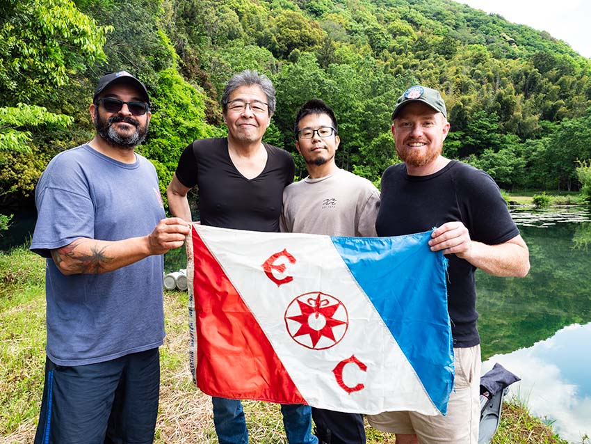 Holding up the flag of The Explorers Club. From left: Mr. Passos, Mr. Sakurai, Isaji, and Mr. Richards.