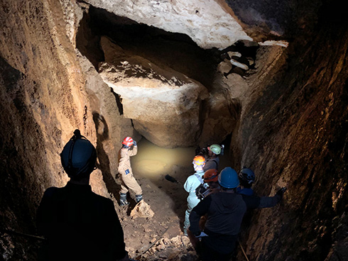 The exploration team checks out the new cave